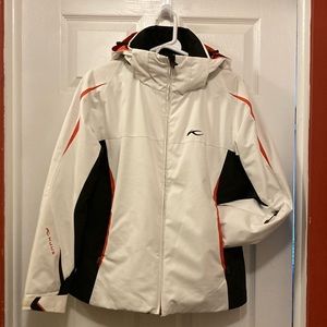 Kjus women’s ski jacket. Gorgeous, classic white with black & orange detailing.
